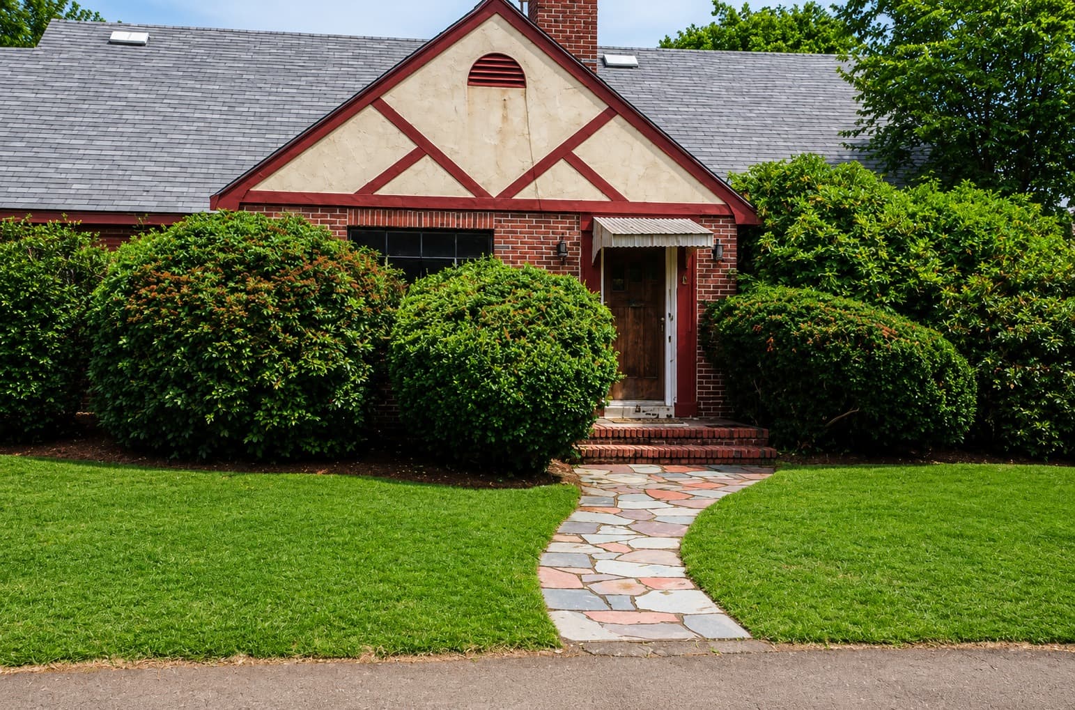 Completed sod lawn with tight seams and a smooth finish toward the foundation